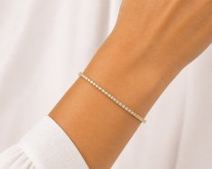 MINET Elegantní tenisový zlatý náramek s bílými zirkony JMG0375WGB16
